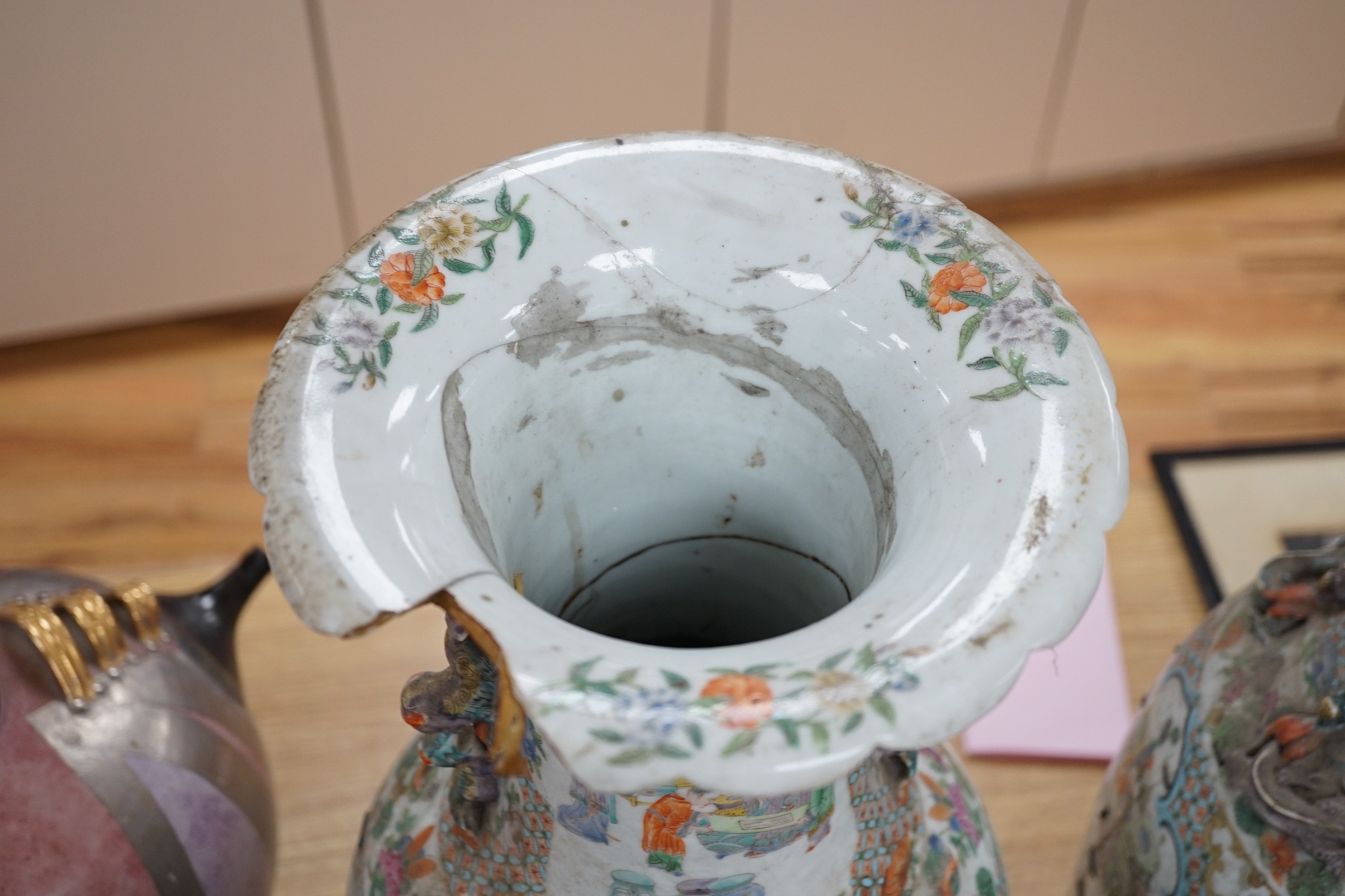 A large pair of Chinese export famille verte dragon vases (in need of restoration), 63cms high
